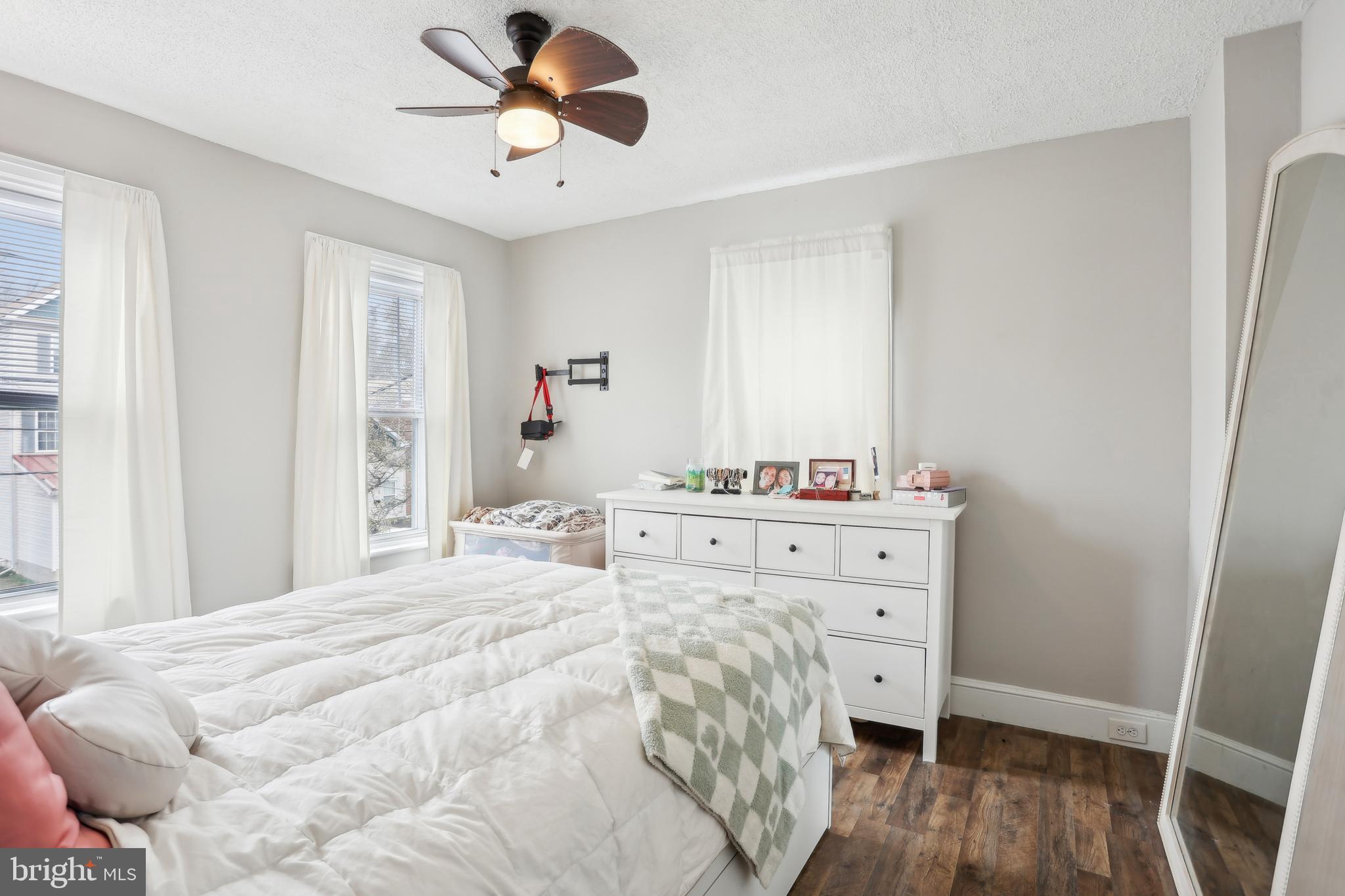 705 Burlington Avenue Delanco, NJ 08075 - Photo 28 of 41 a bedroom with a bed and wooden floor
