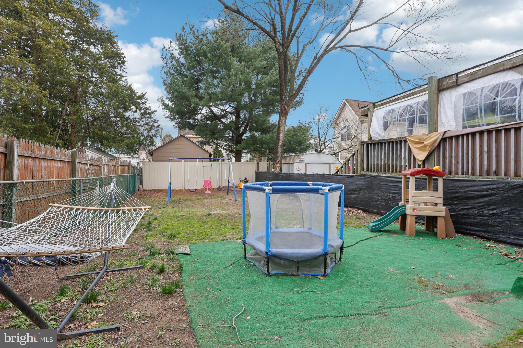 705 Burlington Avenue Delanco, NJ 08075 - Photo 31 of 41 a view of a chair and table in backyard of the house