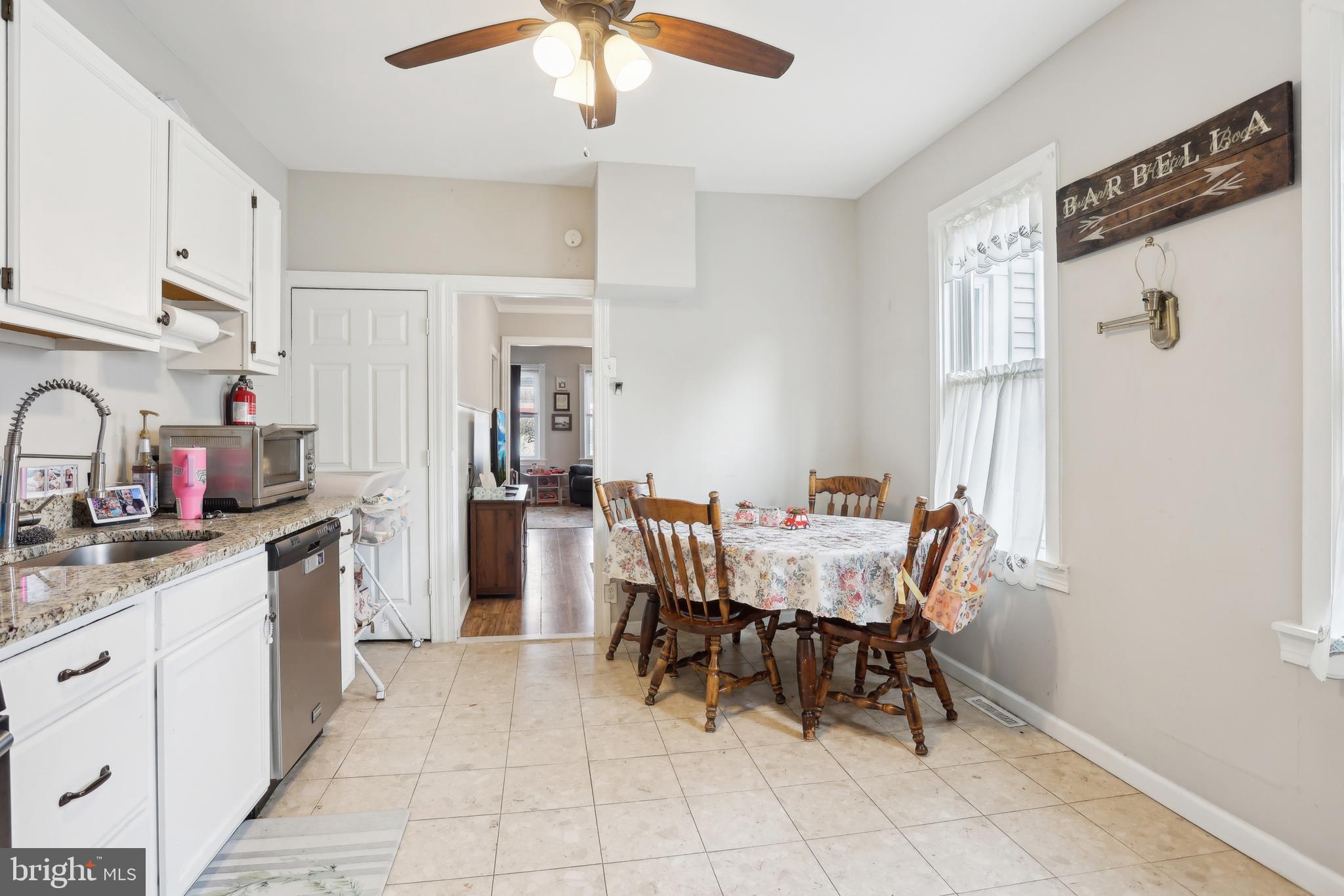 705 Burlington Avenue Delanco, NJ 08075 - Photo 10 of 41 a dining room with stainless steel appliances kitchen island granite countertop furniture and a refrigerator