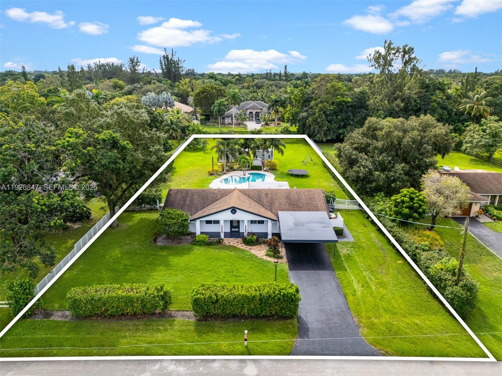 14330 Southwest 16th Street Davie, FL 33325 - Photo 1 of 53 a aerial view of a house with a big yard