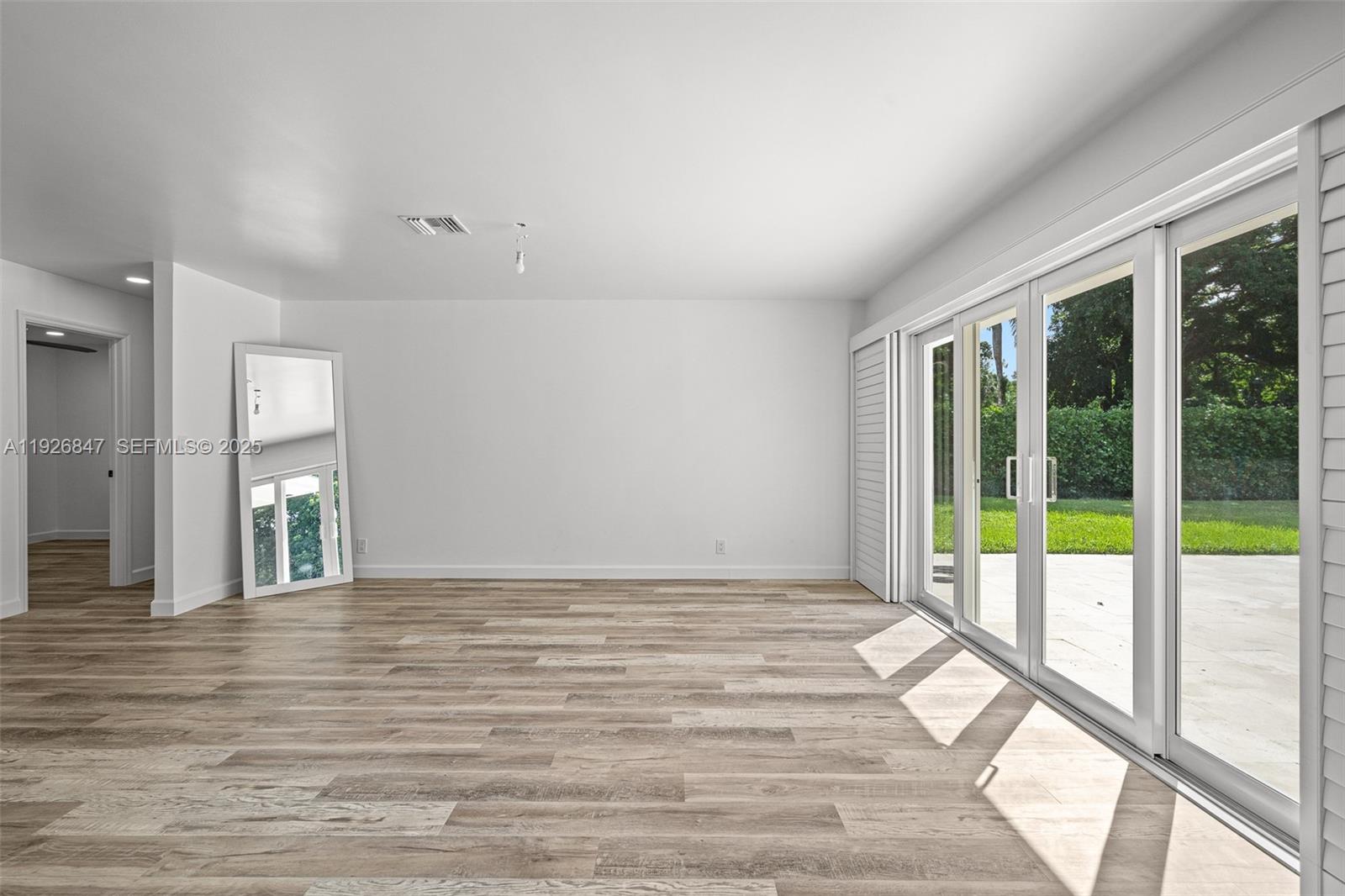 14330 Southwest 16th Street Davie, FL 33325 - Photo 16 of 53 a view of an empty room and glass door