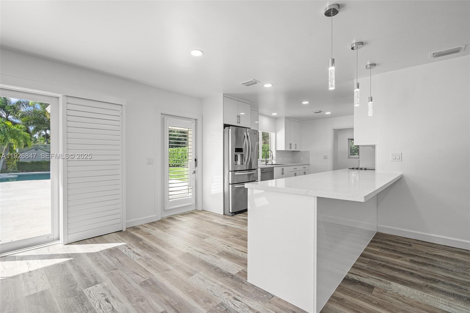 14330 Southwest 16th Street Davie, FL 33325 - Photo 18 of 53 a view of kitchen with stainless steel appliances refrigerator oven and cabinets