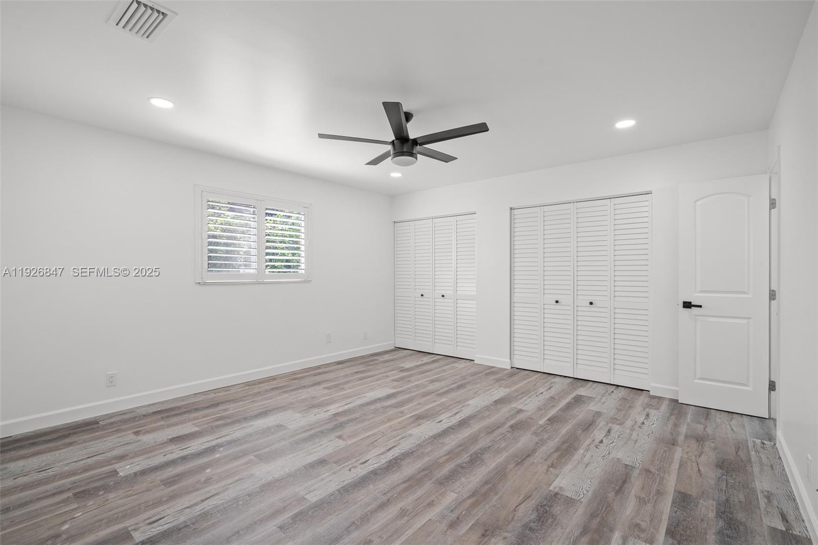 14330 Southwest 16th Street Davie, FL 33325 - Photo 25 of 53 wooden floor in an empty room with a window