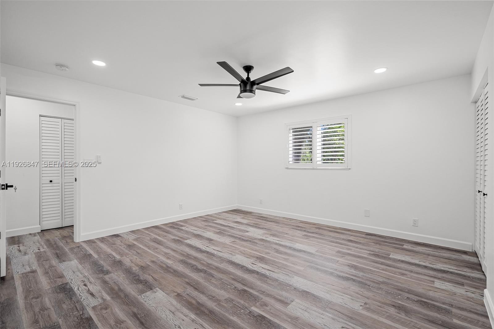 14330 Southwest 16th Street Davie, FL 33325 - Photo 26 of 53 wooden floor in an empty room with a window