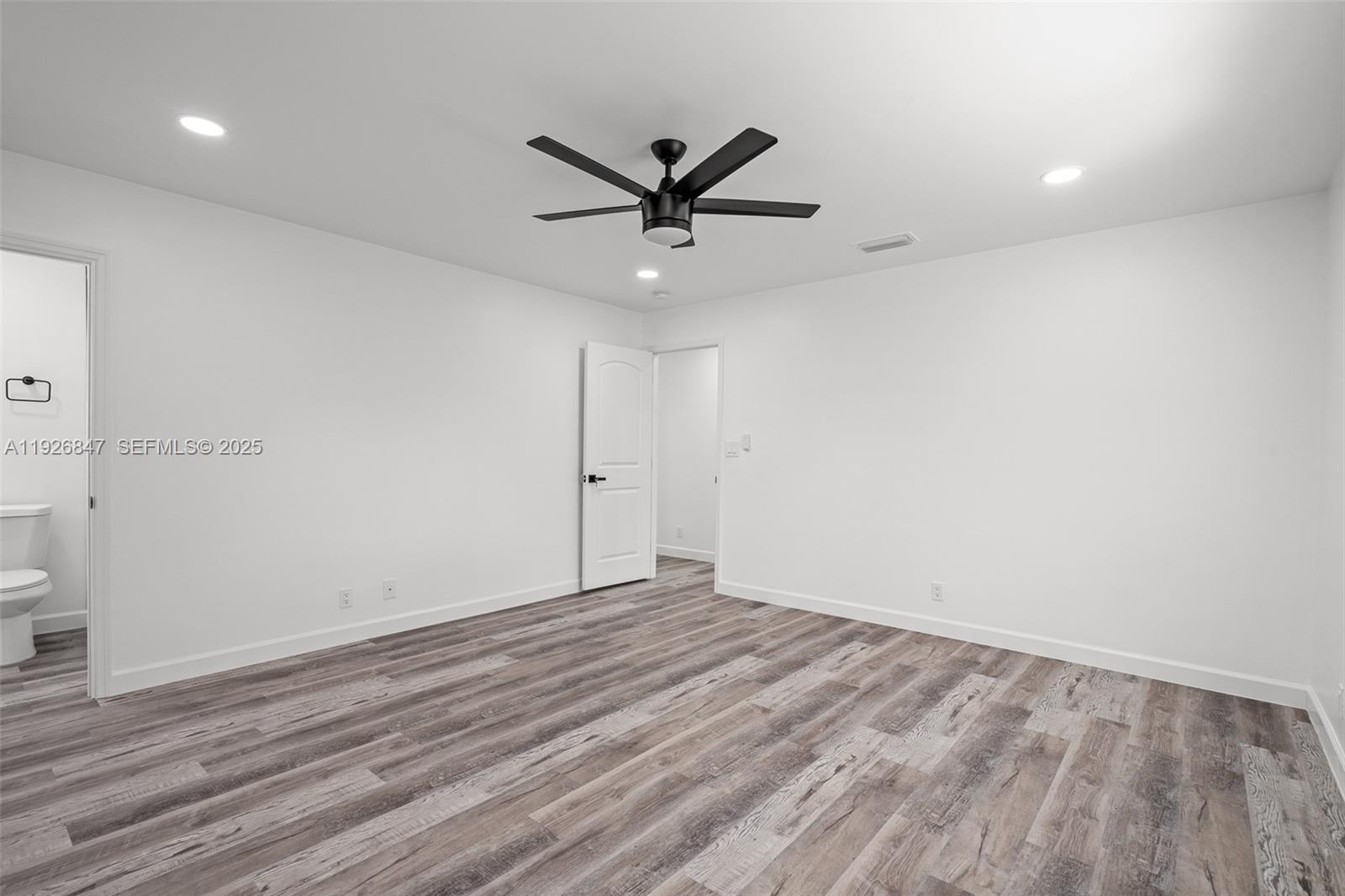 14330 Southwest 16th Street Davie, FL 33325 - Photo 27 of 53 wooden floor in an empty room