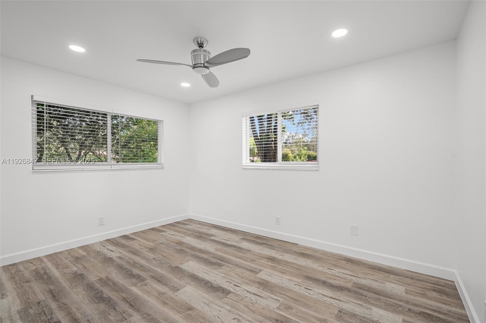 14330 Southwest 16th Street Davie, FL 33325 - Photo 30 of 53 wooden floor in an empty room with a window
