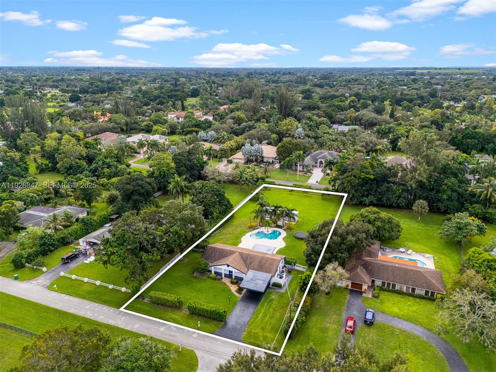 14330 Southwest 16th Street Davie, FL 33325 - Photo 3 of 53 an aerial view of a tennis ground and a houses