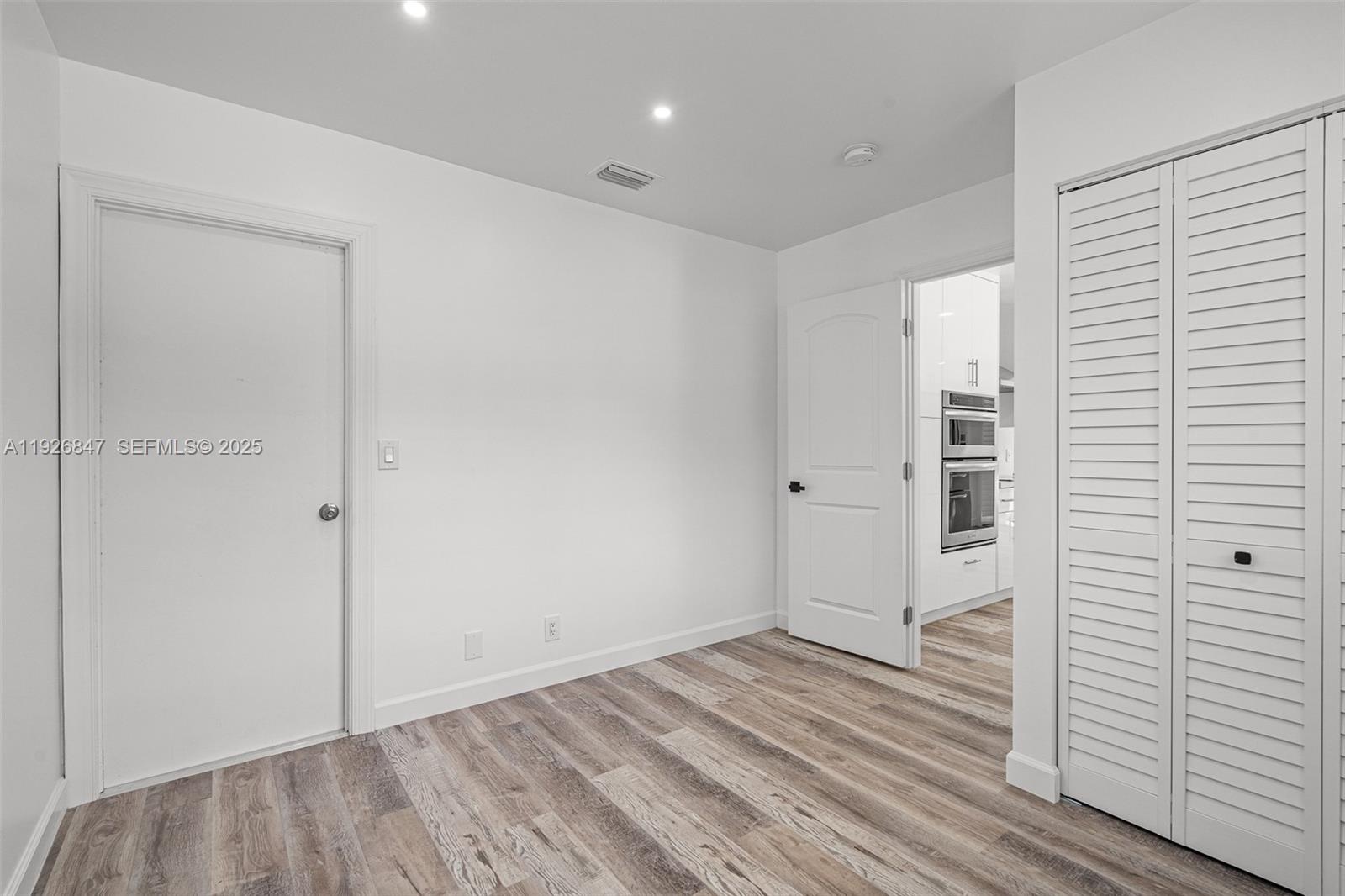 14330 Southwest 16th Street Davie, FL 33325 - Photo 36 of 53 a view of a room with wooden floor