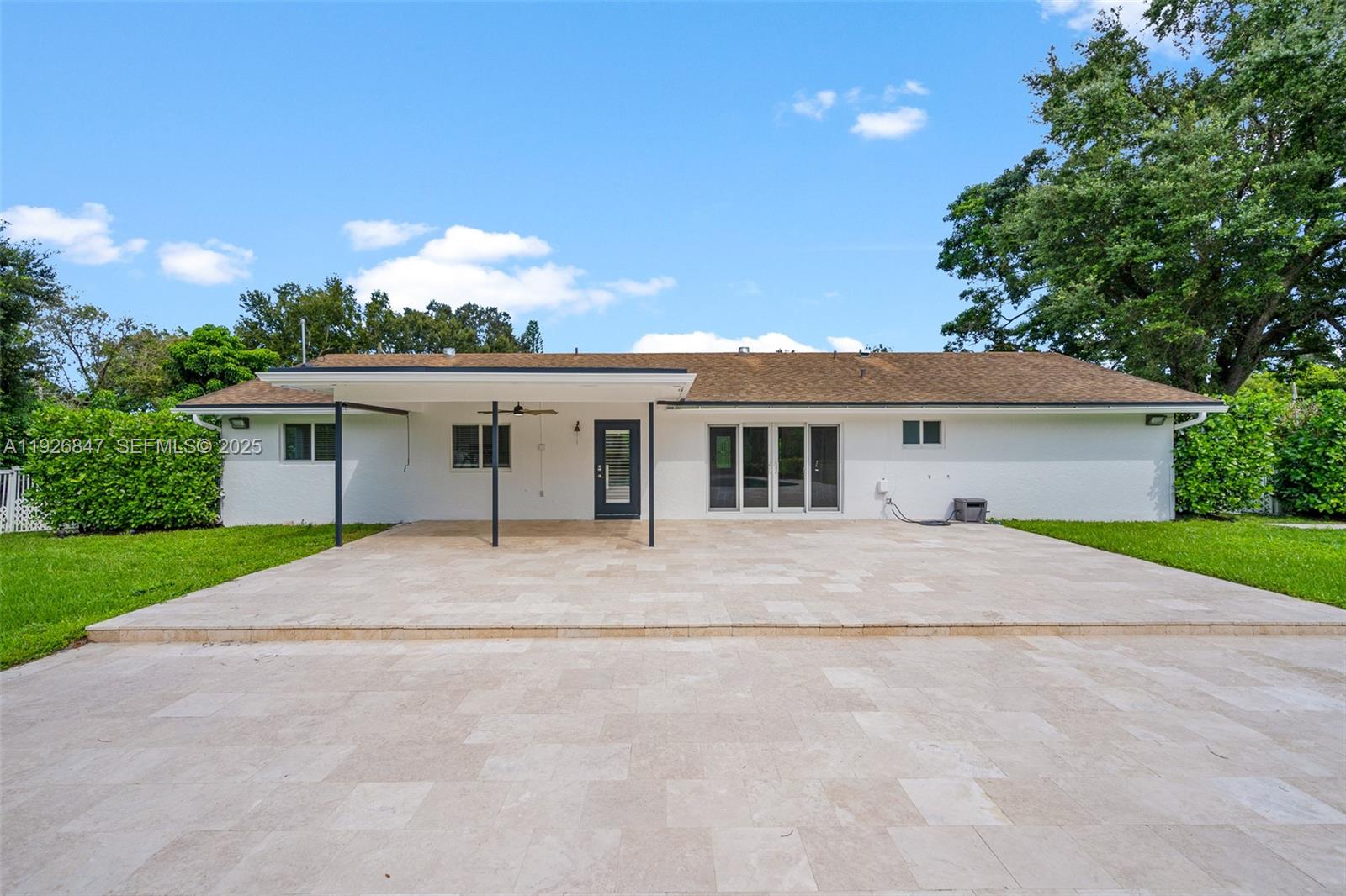14330 Southwest 16th Street Davie, FL 33325 - Photo 38 of 53 front view of a house with a yard and potted plants