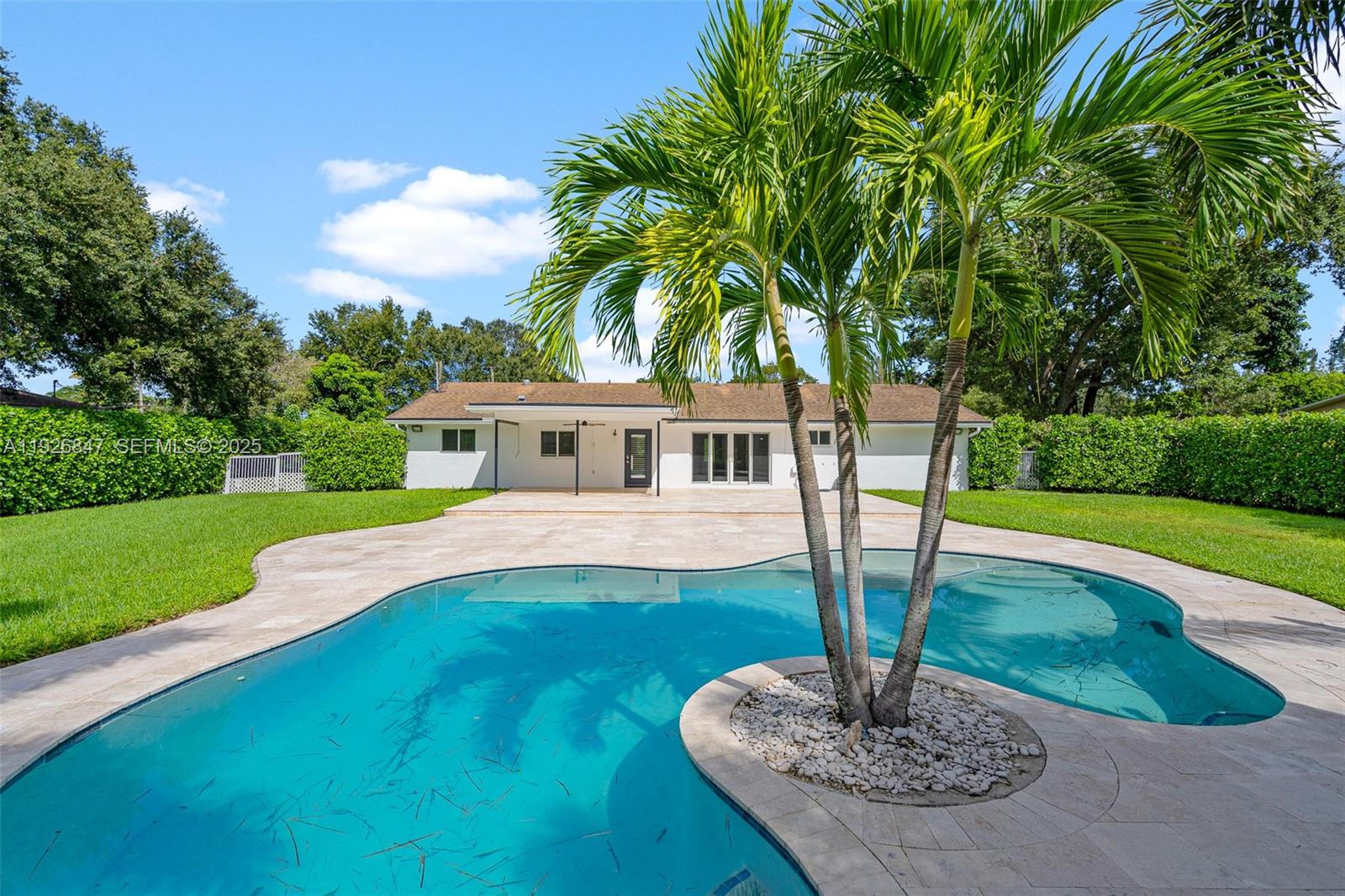 14330 Southwest 16th Street Davie, FL 33325 - Photo 43 of 53 a front view of a house with garden