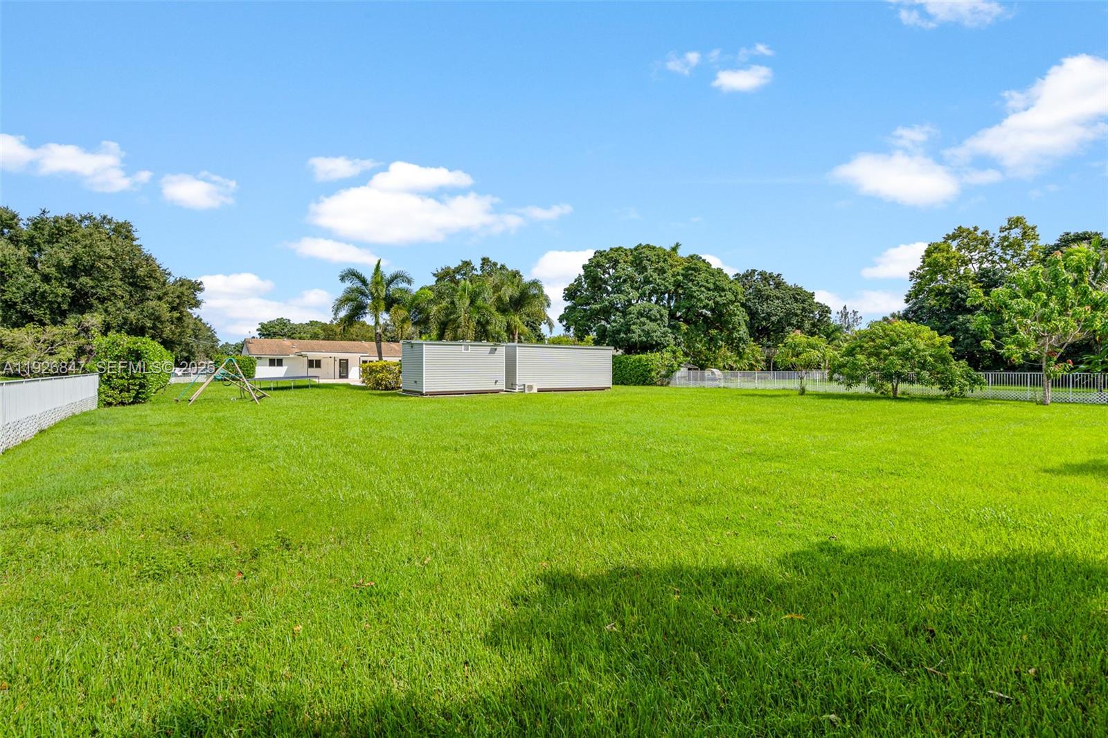 14330 Southwest 16th Street Davie, FL 33325 - Photo 46 of 53 a view of yard with grass & palm trees