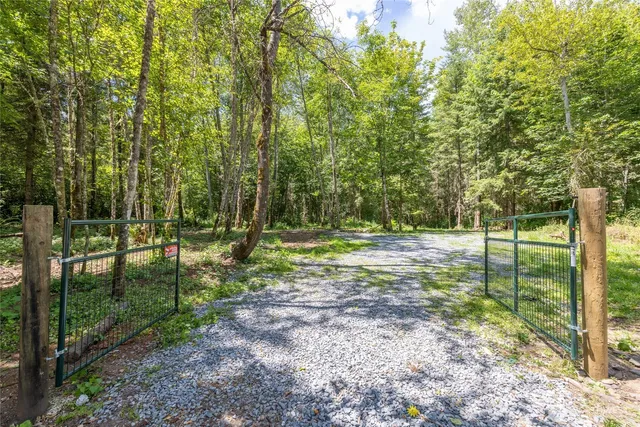 a backyard of a house with lots of green space