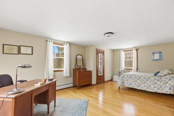 a children room with furniture and a fan