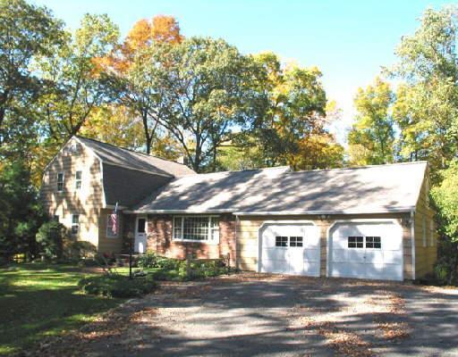 64 Ledgewood Road Redding, CT 06896 - Photo 1 of 1 a front view of a house with a yard