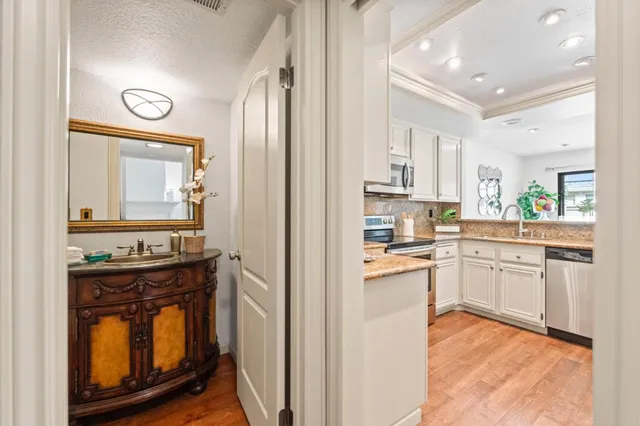 a kitchen with cabinets and window