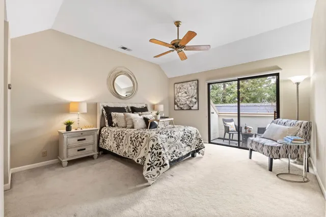 a bed room with a bed and a large window