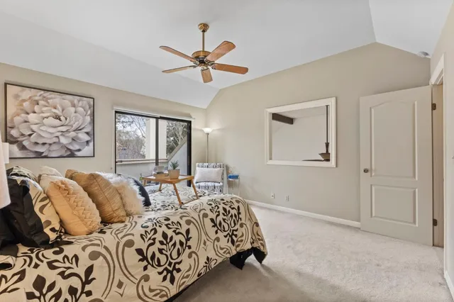 a bedroom with two beds and a window