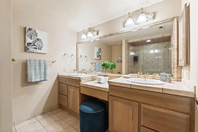 a kitchen with a sink and a refrigerator