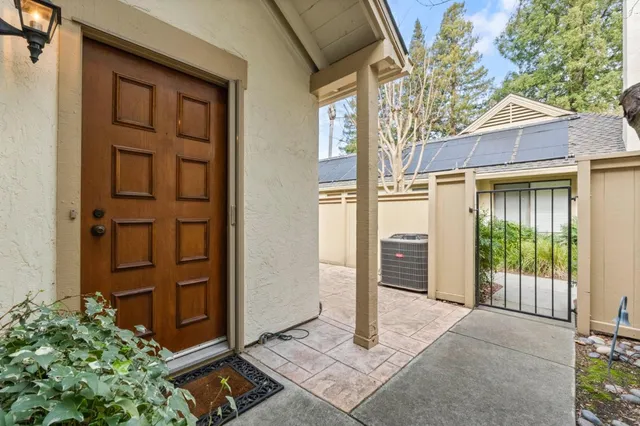 a view of a house with a door and wooden walls