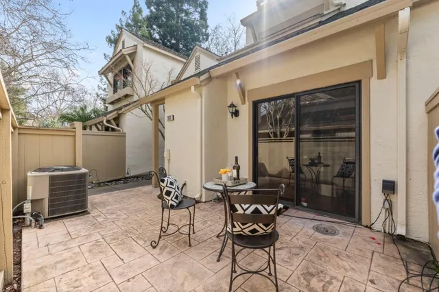 a patio with table and chairs