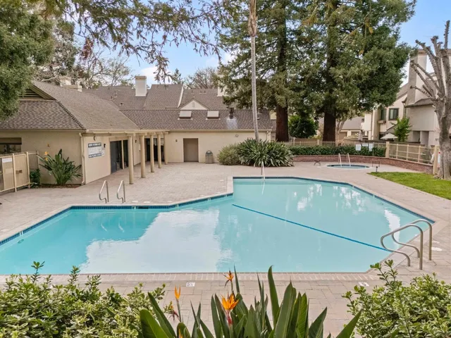 an aerial view of a house with a swimming pool