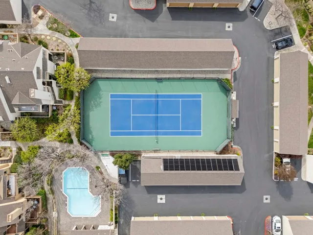 a view of an outdoor space and tennis court