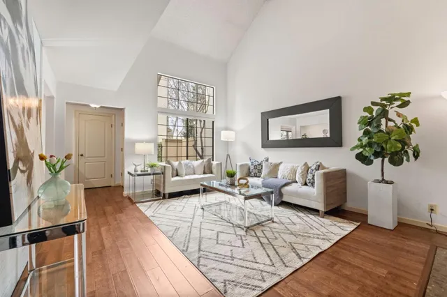 a living room with furniture or couch and a potted plant