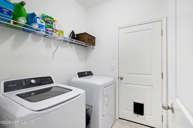 a utility room with dryer and washer