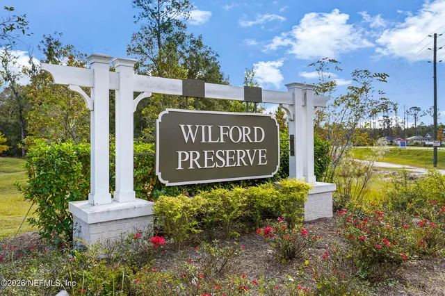 a sign broad in front of the house