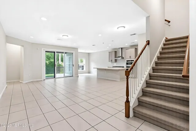 a view of an entryway with wooden floor and door