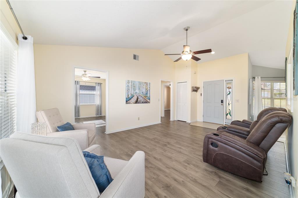4385 North Bacall Loop Beverly Hills, FL 34465 - Photo 17 of 60 a living room with furniture and a chandelier