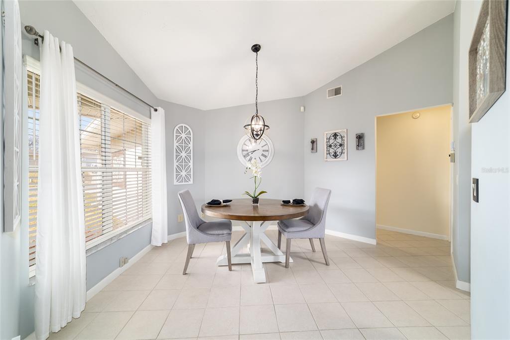 4385 North Bacall Loop Beverly Hills, FL 34465 - Photo 28 of 60 a dining room with furniture and window