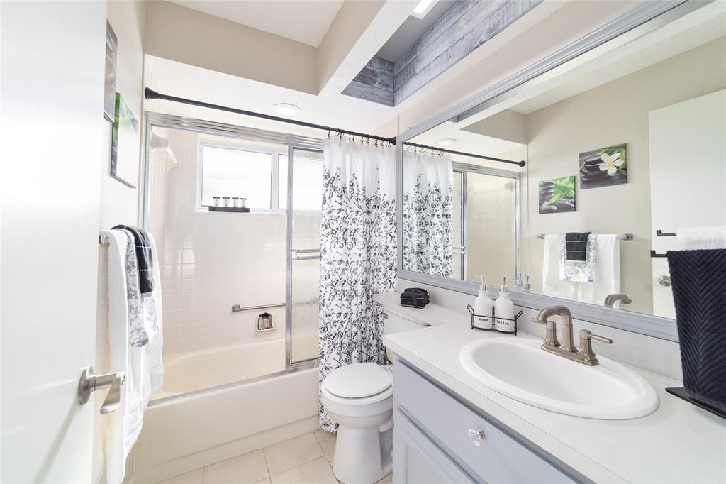 4385 North Bacall Loop Beverly Hills, FL 34465 - Photo 42 of 60 a bathroom with a sink a toilet and shower