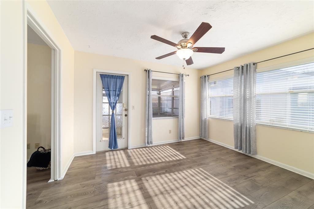 4385 North Bacall Loop Beverly Hills, FL 34465 - Photo 44 of 60 a view of a big room with wooden floor and windows