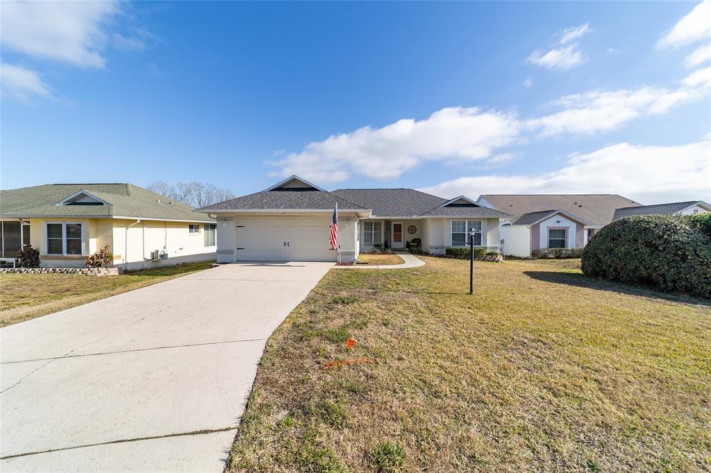 4385 North Bacall Loop Beverly Hills, FL 34465 - Photo 5 of 60 a front view of a house with a yard