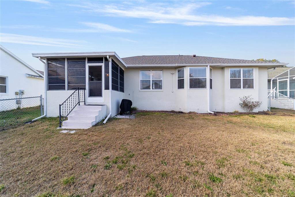 4385 North Bacall Loop Beverly Hills, FL 34465 - Photo 53 of 60 a view of a house with backyard and sitting area