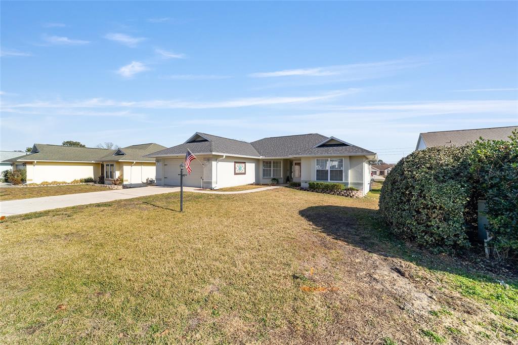 4385 North Bacall Loop Beverly Hills, FL 34465 - Photo 6 of 60 a front view of a house with a yard