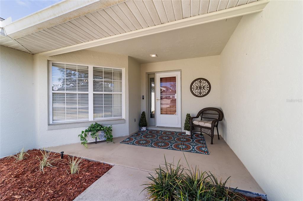 4385 North Bacall Loop Beverly Hills, FL 34465 - Photo 10 of 60 a front view of a house with garden