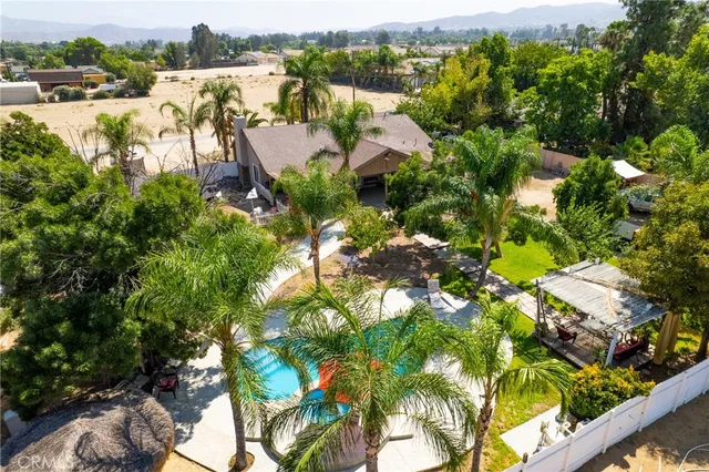 a view of a backyard with swimming pool