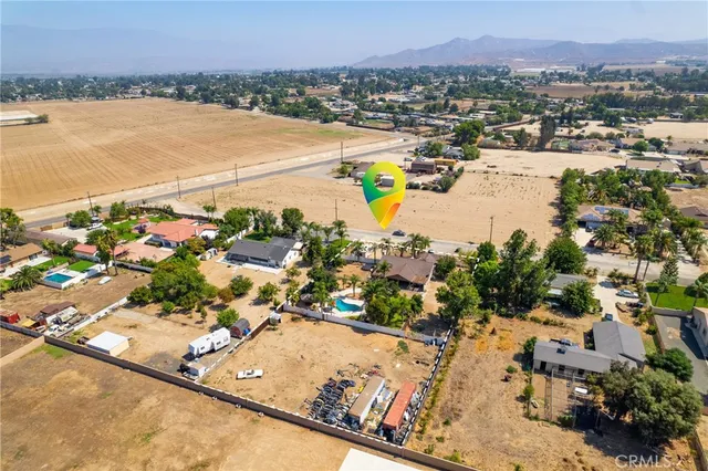 an aerial view of a house with a lake view