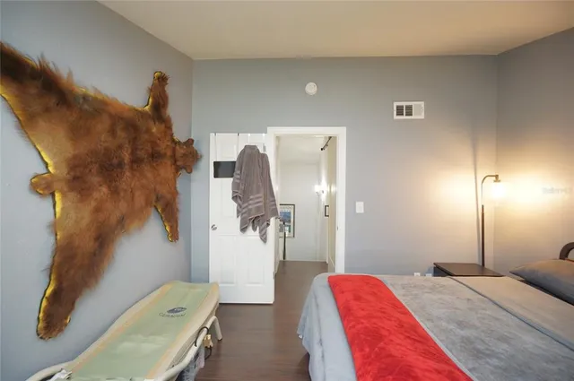 a bedroom with a bed and a couch