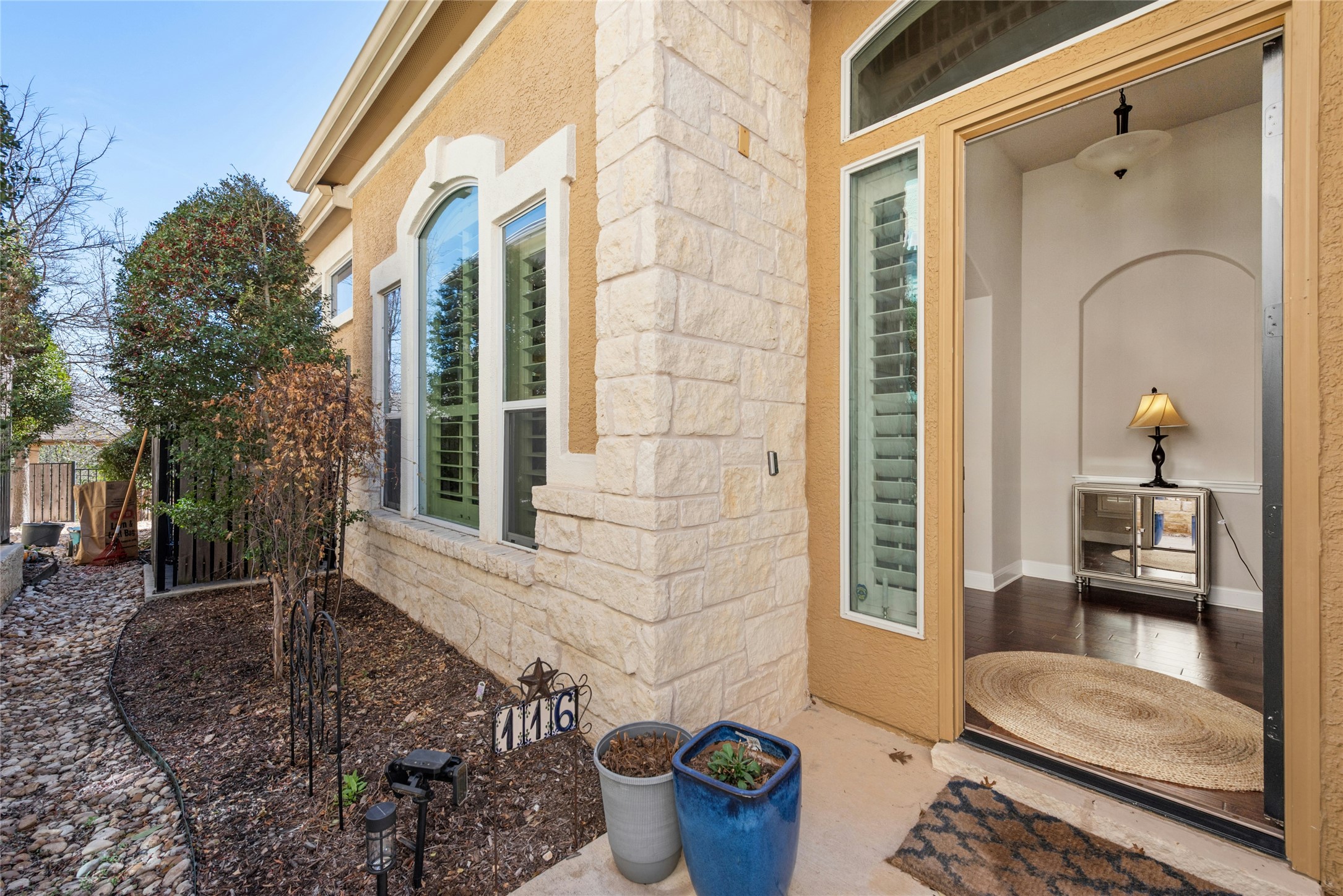 116 Evolutions Path Lakeway, TX 78738 - Photo 4 of 34 Entrance to property featuring stone siding and a patio