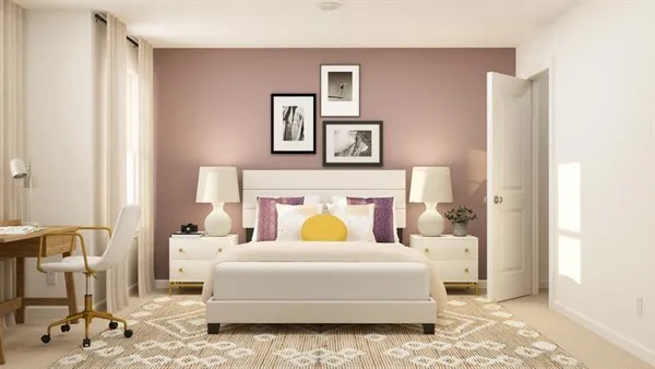 a bedroom with a bed and chair