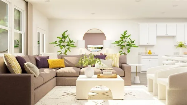 a living room with furniture flowerpot and a window