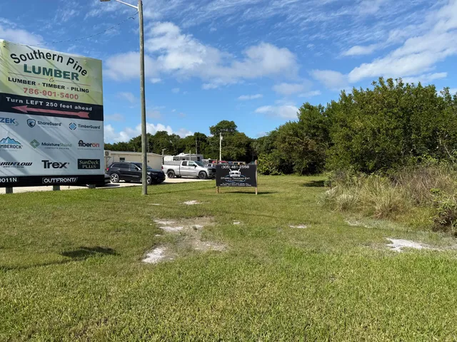 a view of a golf course with a tree