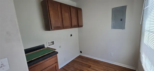 a room with wooden floor and carpet