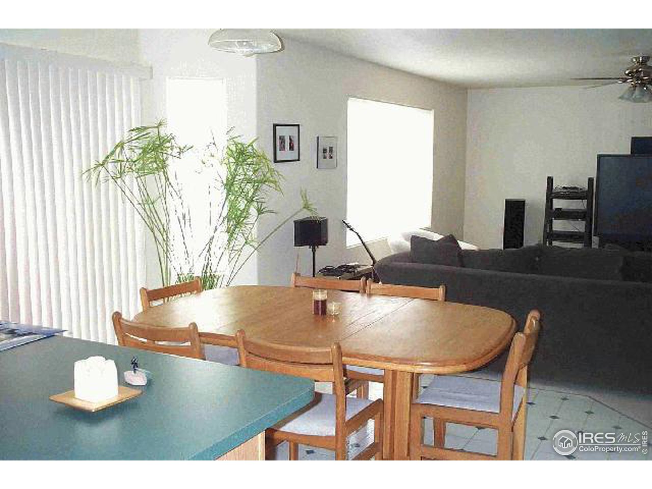 1269 Trail Ridge Road Longmont, CO 80504 - Photo 4 of 7 a dining room with furniture and wooden floor