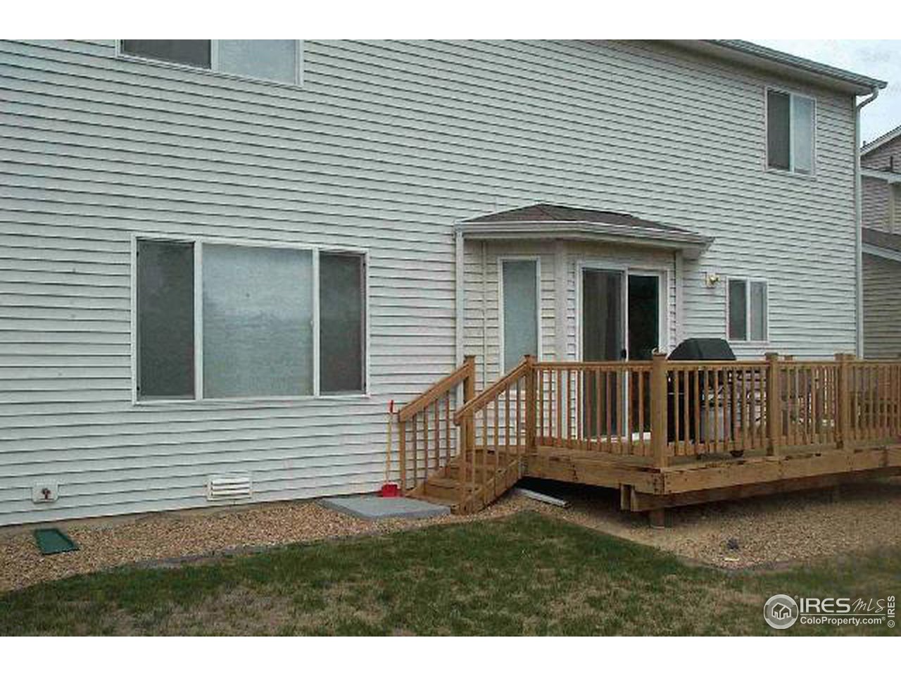 1269 Trail Ridge Road Longmont, CO 80504 - Photo 7 of 7 a view of a house with a wooden deck