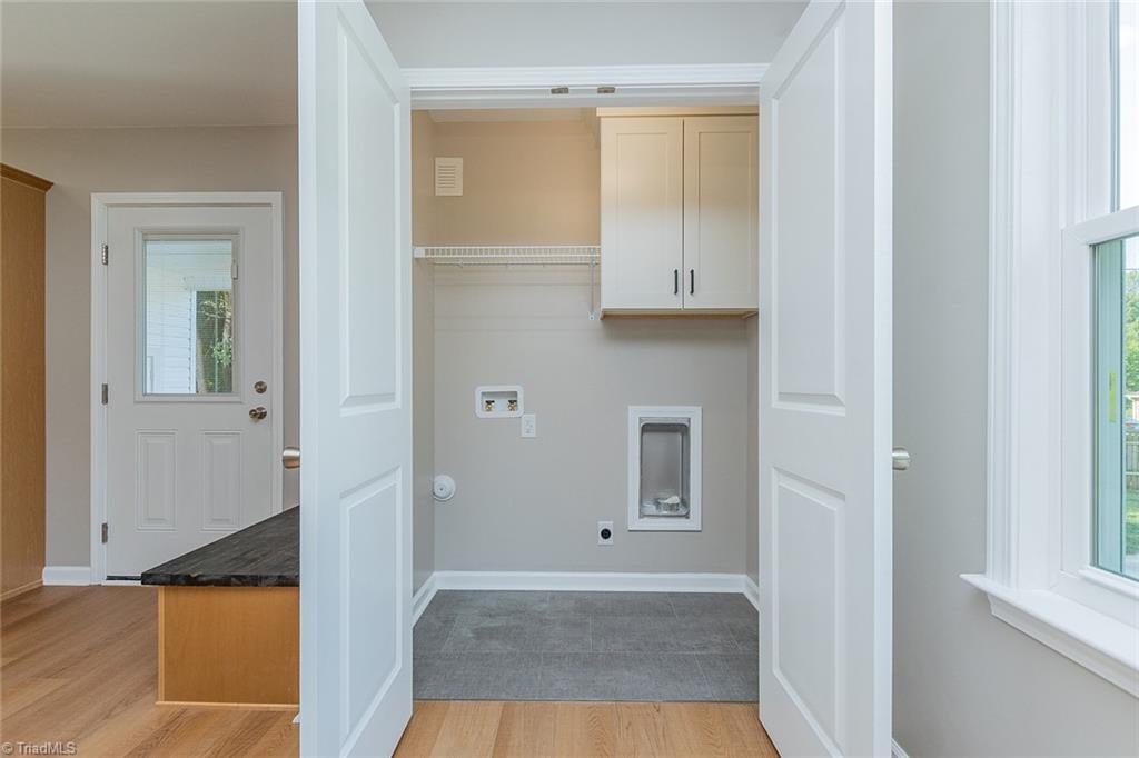 174 Brown Road Linwood, NC 27299 - Photo 11 of 36 Laundry Closet with Cabinet