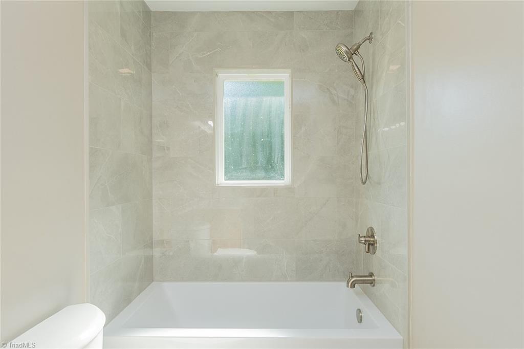 174 Brown Road Linwood, NC 27299 - Photo 21 of 36 New tiled tub